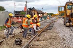 Construction workers working on the new train tracks in Grapevine, Texas